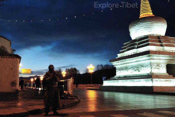 A Prostration Pilgrim Praying In Front of Potala Palace.