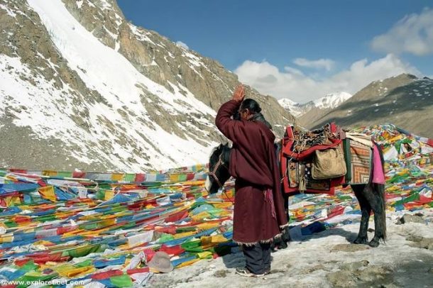 Praying at Dolma La Pass, the highest point on the Mount Kailash Kora