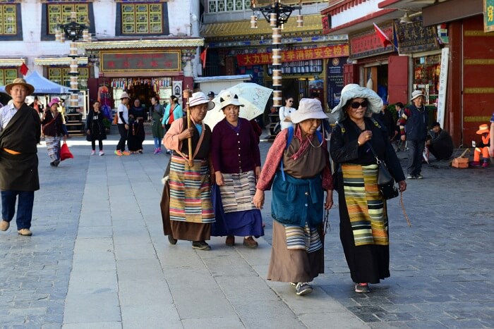 Tibetan pilgrims making holy Kora at the Barkhor street in Lhasa