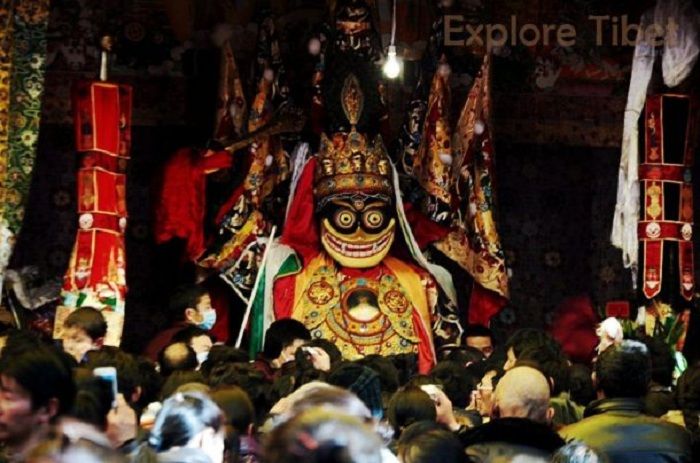 Floats parade through the streets during the Palden Lhamo Festival