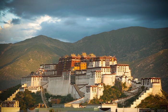 Potala Palace in summer, with a few grey rainclouds heading this way