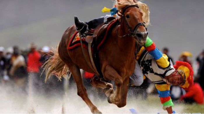 Riders perform daring stunts during the Gyantse Horse Racing festival