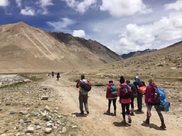 Tourists trekking on the kora route around Mount Kailash