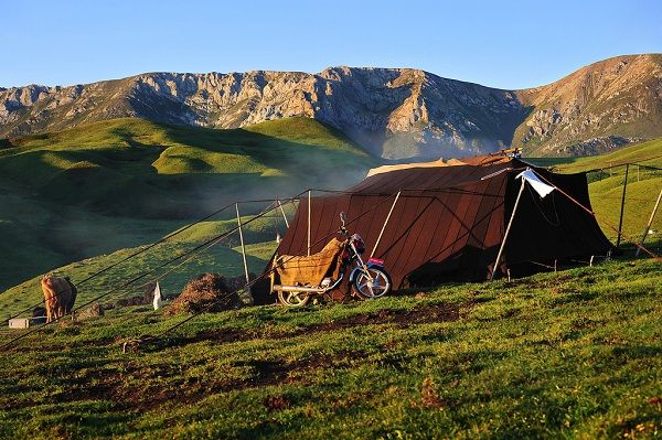 A more modern Tibetan nomad tent made from nylon, complete with motorcycle, two of the few modernizations of yak herders