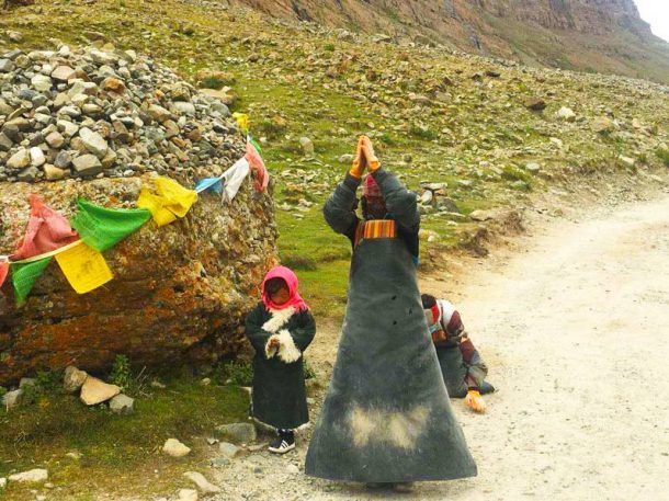 Buddhist followers prostrating around the Mount Kailash -Explore Tibet