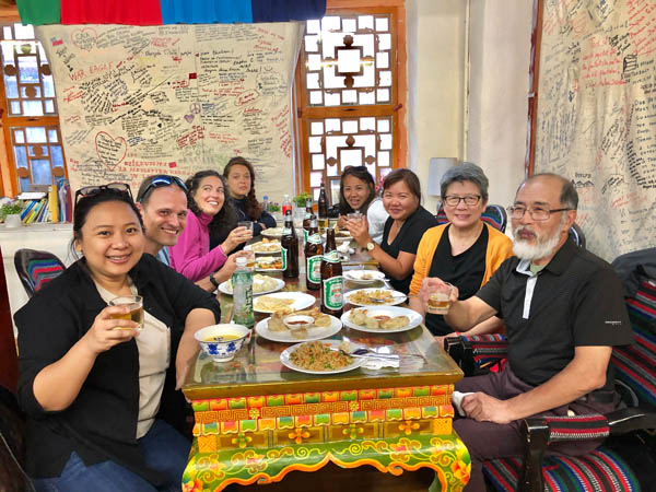 Our clients having fun at Tibetan restuarant in Lhasa, Tibet