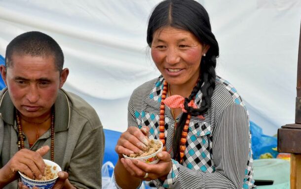 Local Tibetan having their breakfast Tsampa