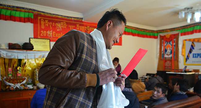 Tselha receiving annual best guide award from Explore Tibet