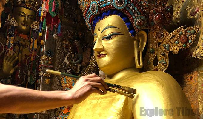 Gold plating at Jokhang temple by Explore Tibet