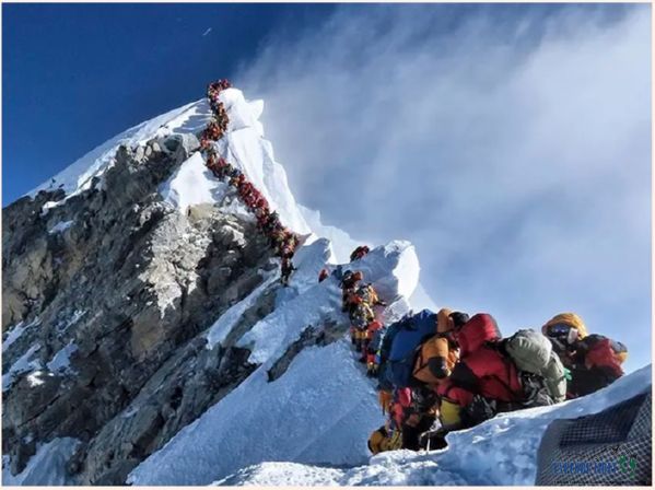 Photo taken on May 21 on Mount Everest's northern slopes on the Hillary Step as climbers wait for their turn to take a photo at the summit.