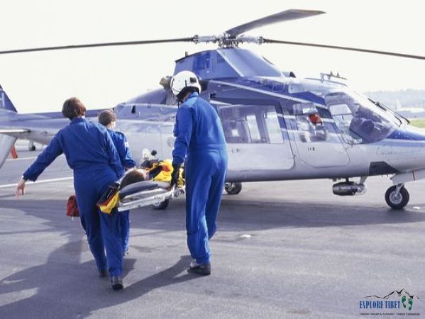 A patient is loaded into the emergency air ambulance to be taken to hospital in Lhasa.