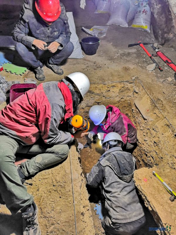 A team led by Dr. Dongju Zhang excavate the cave where the jawbone was discovered that has been traced to a mysterious human species called the Denisovans.