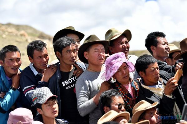 Local residents and visitors watch a bullfight at Tsesha Township in southwest China's Tibet Autonomous Region