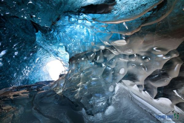 Exploring the beauty of the melting ice formations inside the glacier