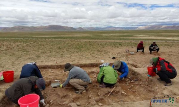 Archaeologists excavating a site in Tibet